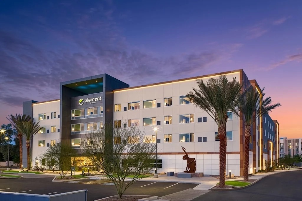 Trimark hotel exterior at dusk